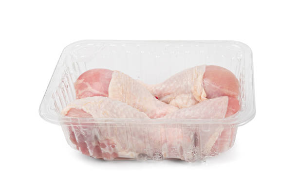 istock Raw Chicken Drumsticks in a Plastic Container Isolated, Uncooked Poultry Legs, Fresh Hen Meat 1992747941