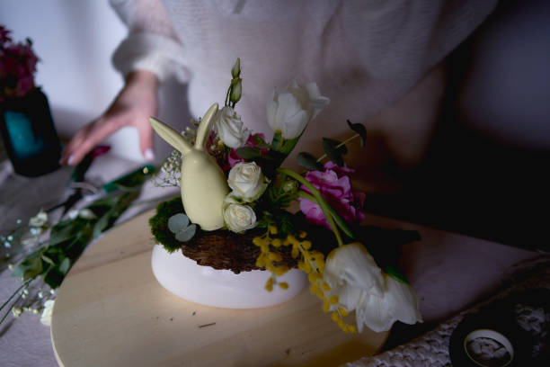 female florist make decorations and floral arrangements for Easter