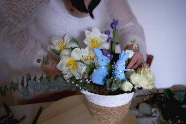 istock female florist make decorations and floral arrangements for Easter 1992754925