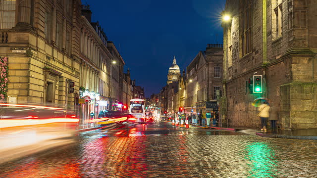 4K Footage Time lapse of photos blur of Crowded Commuter People and Tourist walking and traveling around Museum on the Mound area and Royal Mile area in old town Edinburgh, Scotland, United Kingdom