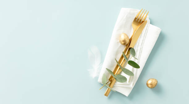 istock Stylish Easter brunch table setting with eggs and golden cutlery 1992788593
