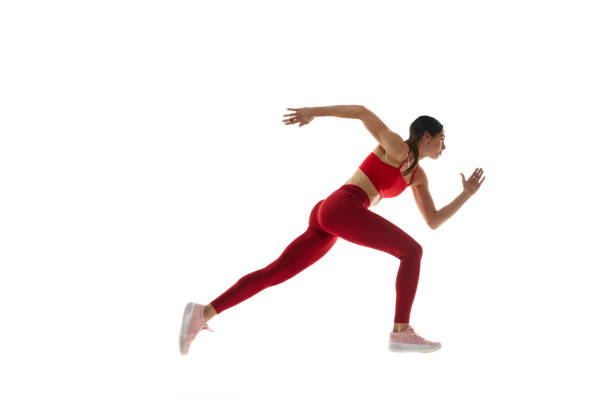 istock Side view. Athletics. Motivated woman in motion, running, training against white studio background. Tournament 1992797140