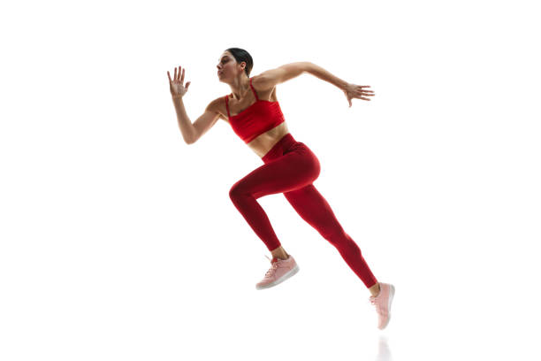 istock Side view. Athletics. Motivated woman in motion, running, training against white studio background. Tournament 1992797153