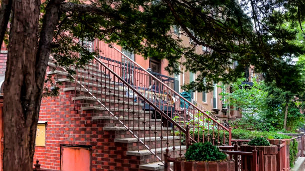New York City townhouse building, Brooklyn Heights residential district, USA. Brownstone urban architecture, attached house. United States real estate, american property, apartments and homes in NYC.