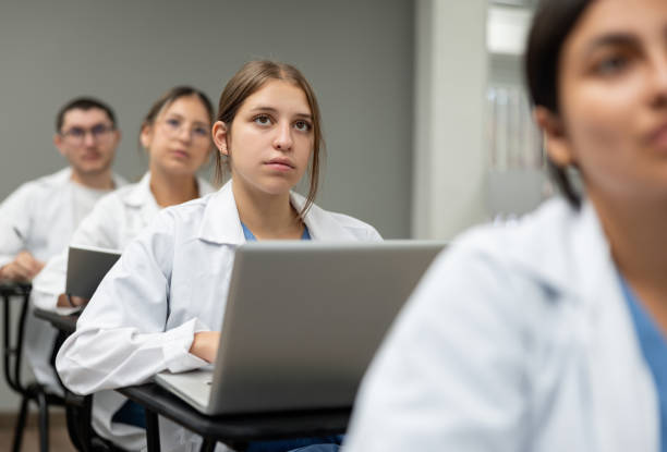 istock Medical student in class and taking notes on her laptop 1992830315