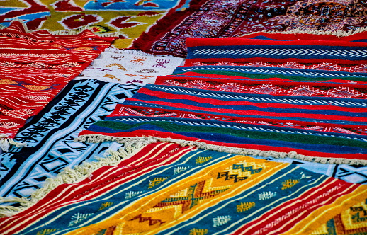 Traditional carpets placed on the ground in a Tunisian market, Kairouan, Tunisia