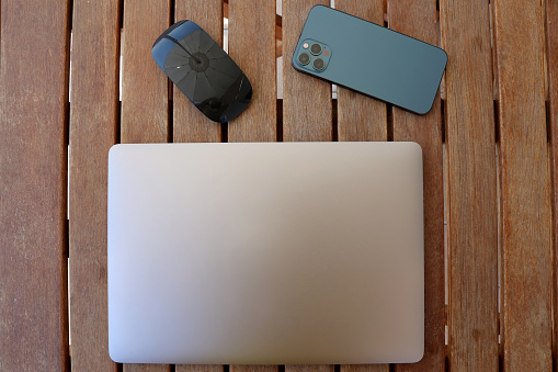 Modern electronic devices mockup on grey background. Laptop computer, smartphone, tablet touchpad, smart watch, and stylus pen white screen mockup. 3d rendering, 3d illustration