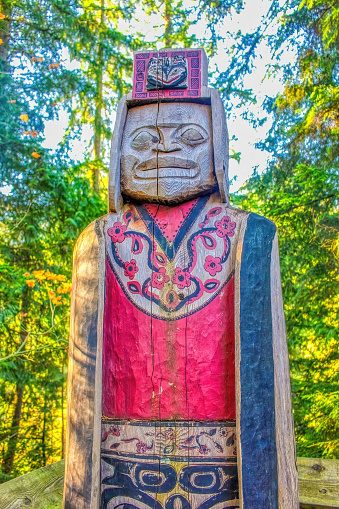 Vancouver, British Columbia, Canada. Dec 13, 2014. Totem pole exhibit showcasing monumental carvings indigenous to the western Americas at the Capilano Suspension Bridge Park.