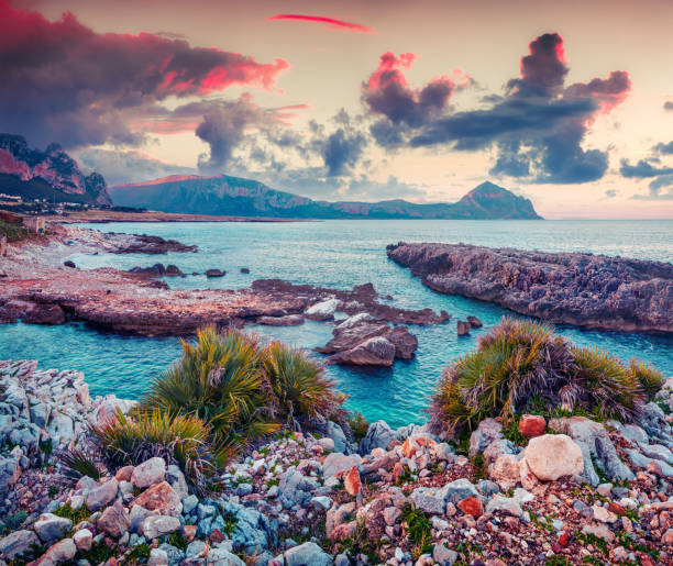 Dramatic spring sunrise on the nature reserve Monte Cofano. Colorful morning scene on the Mediterranean sea, San Vito cape, Sicily, Italy, Europe. Instagram toning.