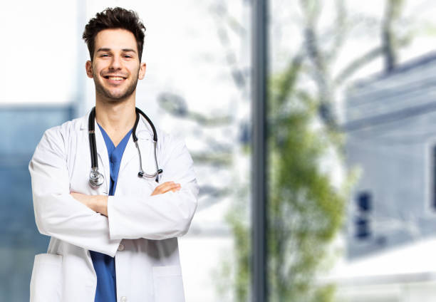 istock Handsome young smiling doctor portrait 1992938094