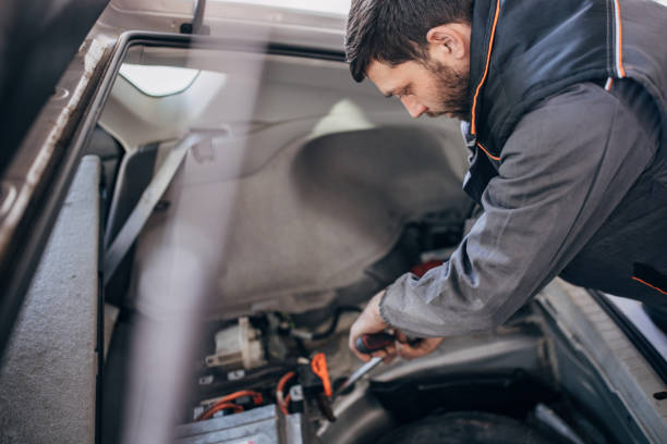 istock Mechanic repairing a car battery 1992952828