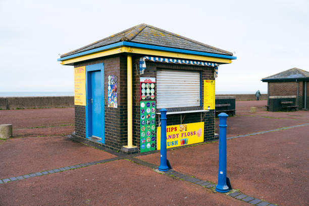 Pensarn Abergele Wales UK 27 January 2024. Seaside snack bar closed for the winter drinks ice creams and chips advertised on painted signs