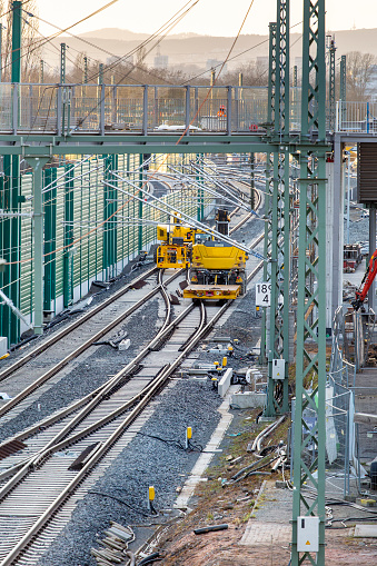 Railroad construction site - laying rail tracks and building noise barriers