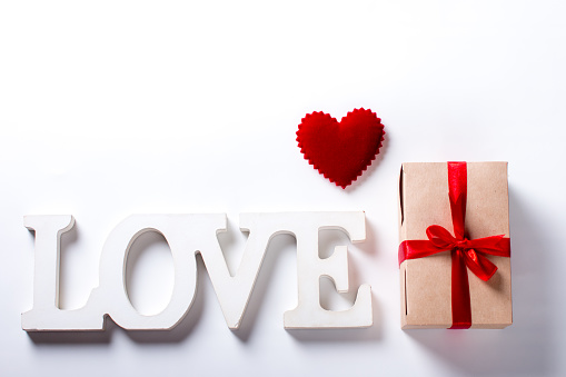 the inscription is love and a gift box. Valentine's Day Greeting Card