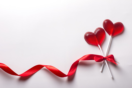 lollipops on a stick in the shape of a heart. Valentine's Day Greeting Card