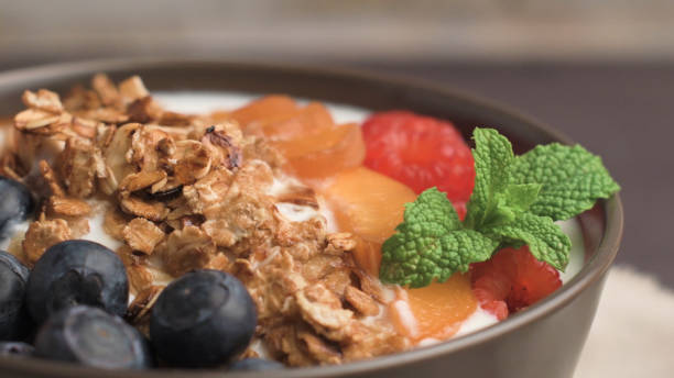 istock Yogurt with baked granola and berries 1993042119