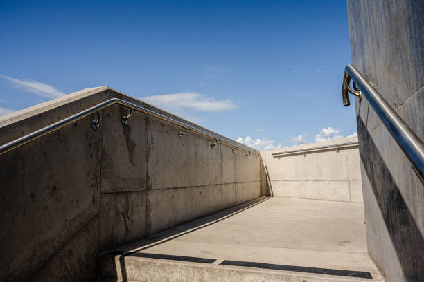 istock Concrete staircase leading up onto a bridge.. 1993059425