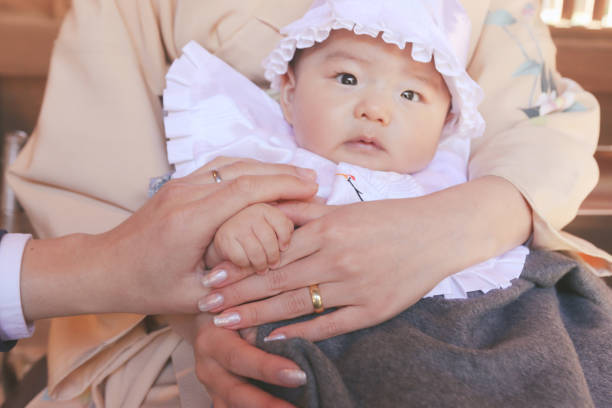 istock Newborn baby hand holding parents hand 1993089495