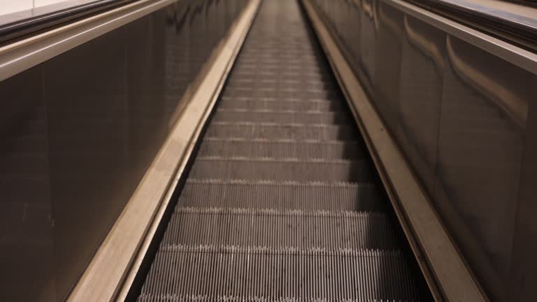 escalator steps moving up, close up view of steps. escalator in the metro