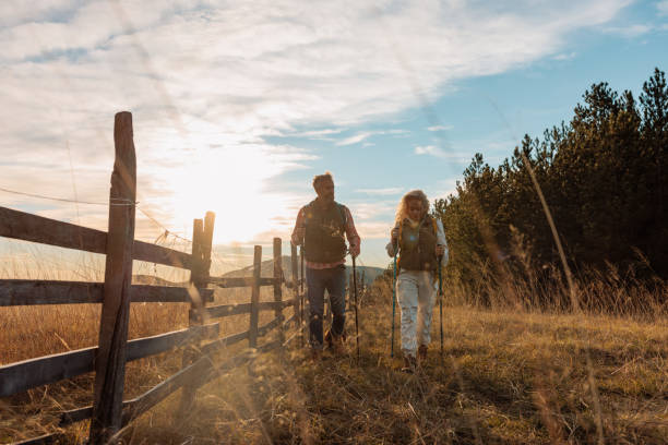 istock Happy couple walking on mountains meadow. 1993103219