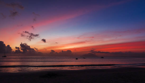 istock Ocean shore water under colorful sky at sunset. Seychelles 1993118945