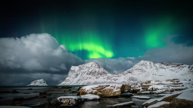 Northern lights (Aurora borealis) over arctic coastline
