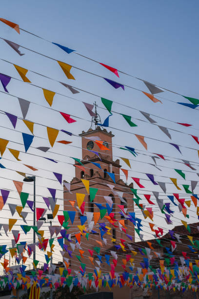 istock Spanish Campanar surrounded by party decorations 1993176785