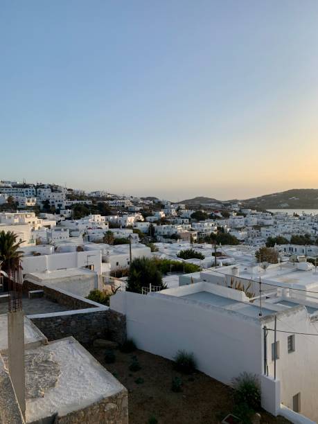 Amazing sunset view, Mykonos island, Cyclades, Greece. Beautiful scenery with Mediterranean colors in a beautiful day Amazing sunset view, Mykonos island, Cyclades, Greece. Beautiful scenery with Mediterranean colors in a beautiful day cultura grega stock pictures, royalty-free photos & images