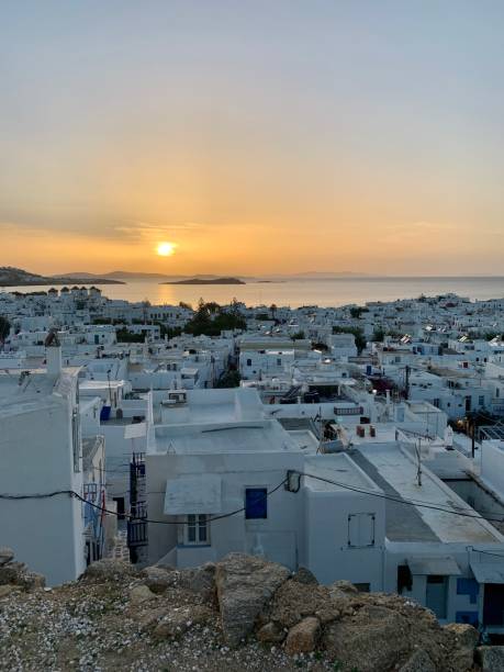 Amazing sunset view, Mykonos island, Cyclades, Greece. Beautiful scenery with Mediterranean colors in a beautiful day Amazing sunset view, Mykonos island, Cyclades, Greece. Beautiful scenery with Mediterranean colors in a beautiful day cultura grega stock pictures, royalty-free photos & images