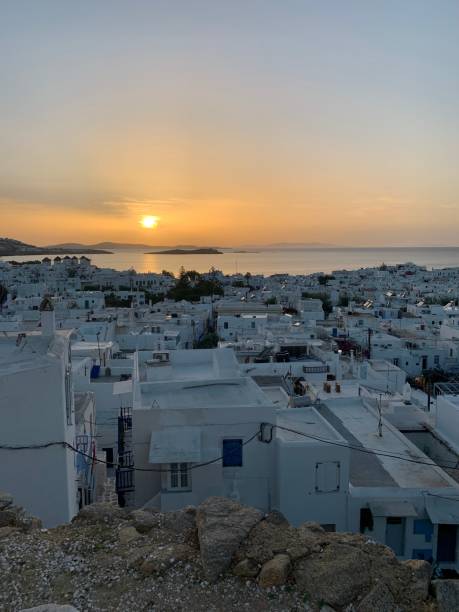 Amazing sunset view, Mykonos island, Cyclades, Greece. Beautiful scenery with Mediterranean colors in a beautiful day Amazing sunset view, Mykonos island, Cyclades, Greece. Beautiful scenery with Mediterranean colors in a beautiful day cultura grega stock pictures, royalty-free photos & images