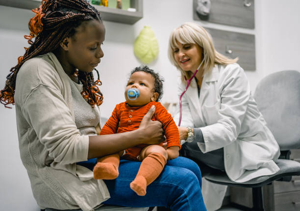 istock Mother with a baby boy at the pediatrician 1993190889