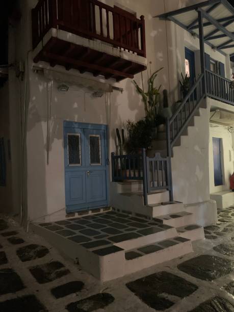 Streets of Mykonos by night at the Cyclades islands in Greece Streets of Mykonos by night at the Cyclades islands in Greece cultura grega stock pictures, royalty-free photos & images