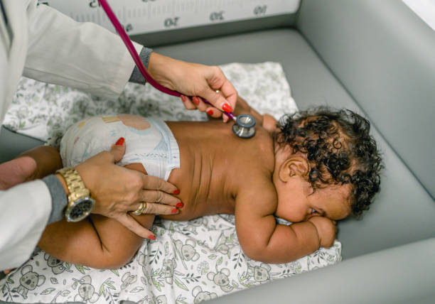 istock Pediatrician examining baby 1993193020