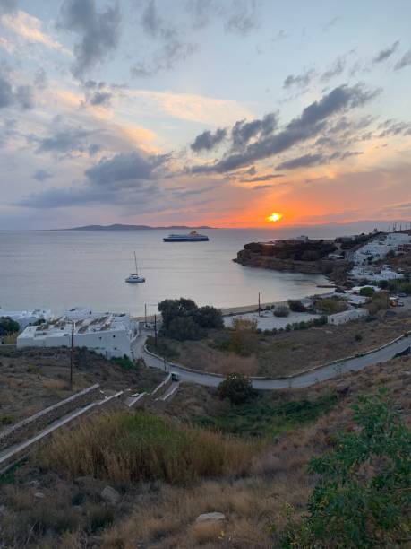 Amazing sunset view, Mykonos island, Cyclades, Greece. Beautiful scenery with Mediterranean colors in a beautiful day Amazing sunset view, Mykonos island, Cyclades, Greece. Beautiful scenery with Mediterranean colors in a beautiful day cultura grega stock pictures, royalty-free photos & images