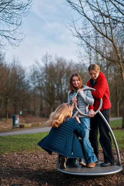 istock Young Teens have Fun in the Park with a Spinning Wheel 1993194593