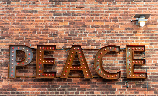 Peace sign on brick building distillery district Toronto