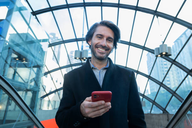 istock View of young man using a smartphone at indoor space with a blurred view landscape 1993220549