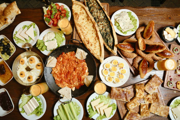 istock Abundant Wooden Table With Array of Delicious Food 1993241599
