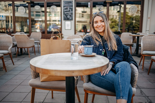 Woman taking a coffee break at the restaurant