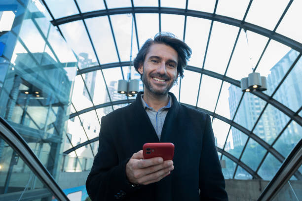 istock View of young man using a smartphone at indoor space with a blurred view landscape 1993254202