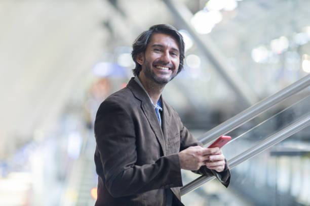 istock View of young man using a smartphone inside a subway - metro station 1993261991