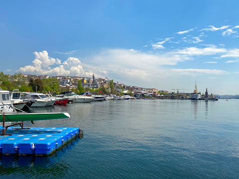 Galata tower view from Karakoy district with City lines ferry crossing the Galata bridge. Istanbul Turkey