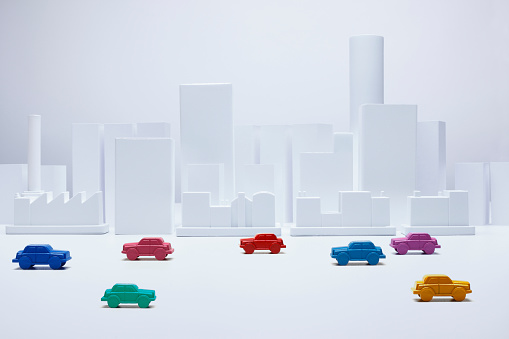 White model city with  colorful toy cars