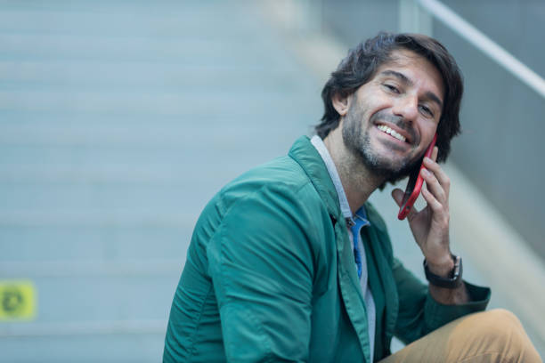 istock View of young man using a smartphone at indoor space with a blurred view landscape 1993291474