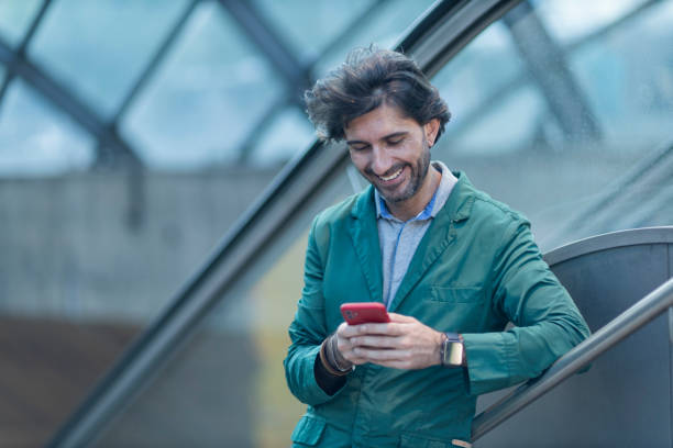 istock View of young man using a smartphone at twilight in an indoor space 1993297279