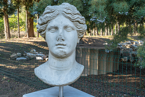 Marble woman sculpture in empty studio room, ancient Greek statue of goddess  3d rendering