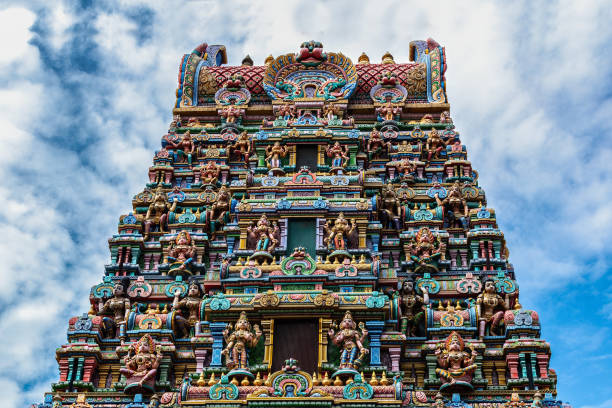 istock Hindu Temple, Bangkok. Colored decorations and statues. Cloudy blue sky in background. 1993303107