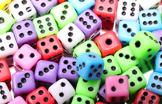 lots of gaming dice for playing casino in many colors