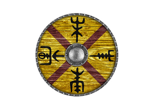 Old decorated wooden round shield isolated on white background