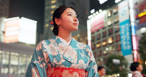 Thinking, Japanese woman and peace with decision, journey and opportunity with traditional clothes, wonder or travel. Person, outdoor or girl in the streets, adventure or peace with thoughts or night